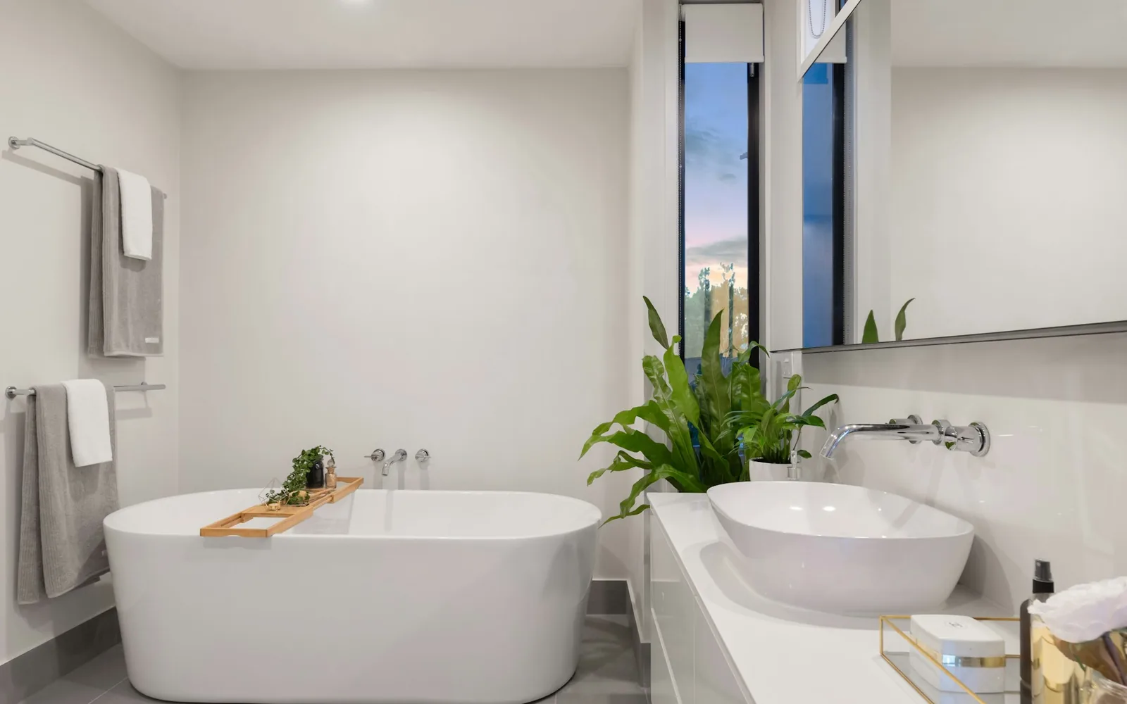 Clean towels arranged in a serene bathroom