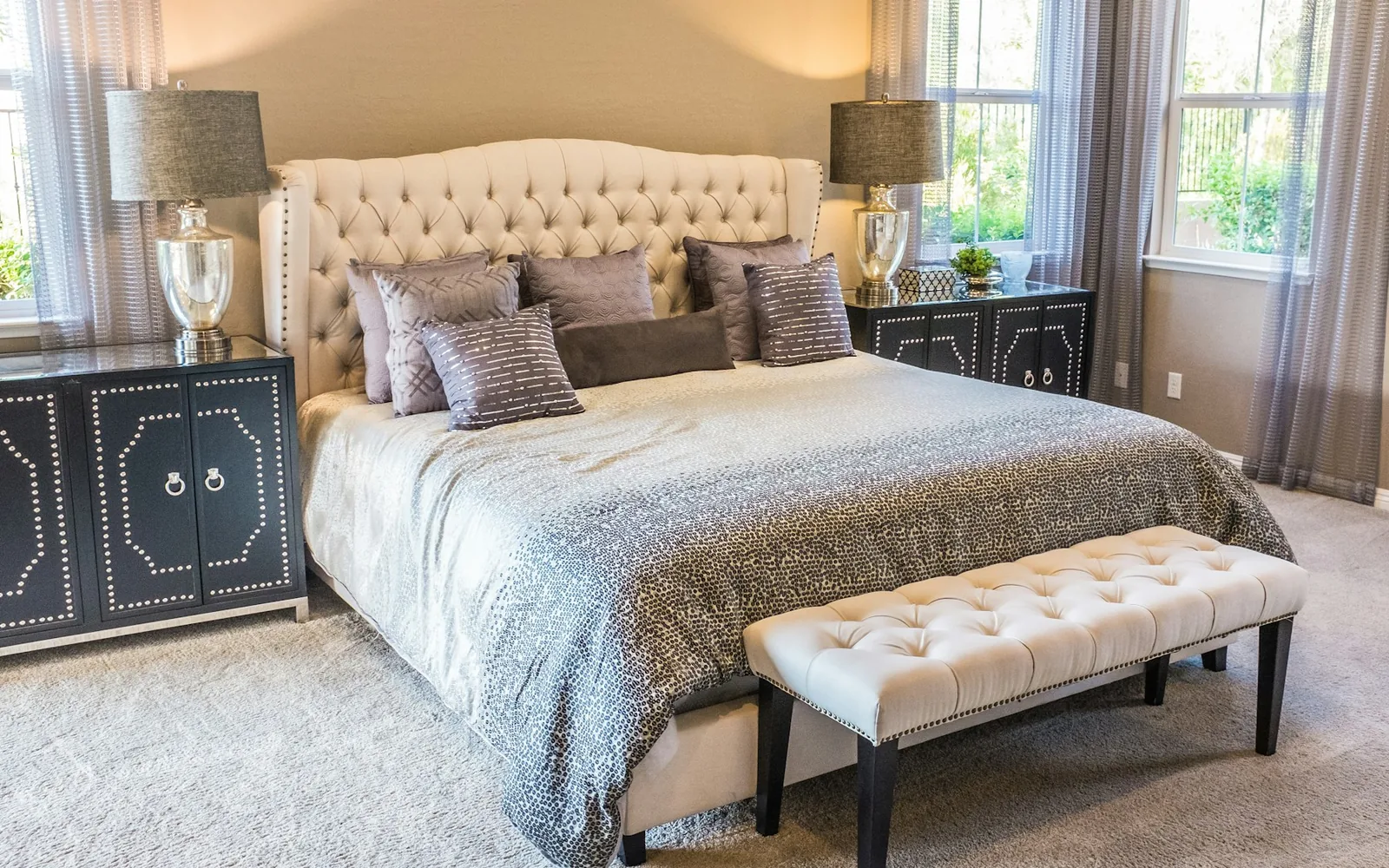 A comfortable bed prepared with fresh pillows and linens