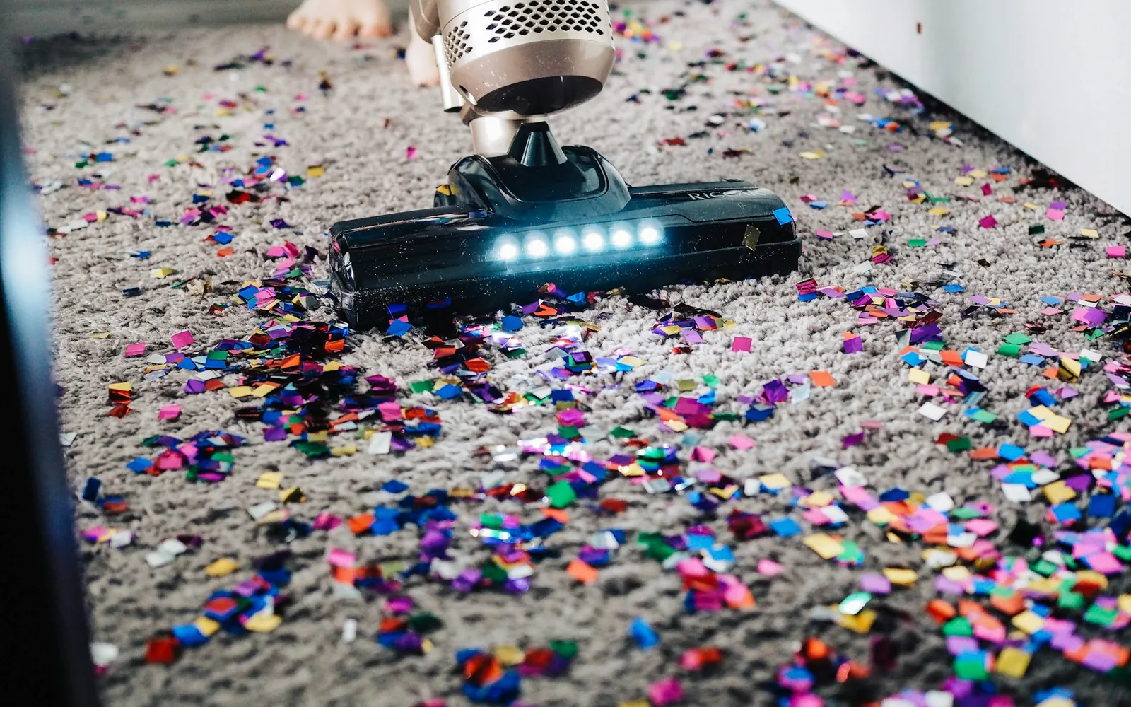 A vacuum and floor-cleaning scene in a real home